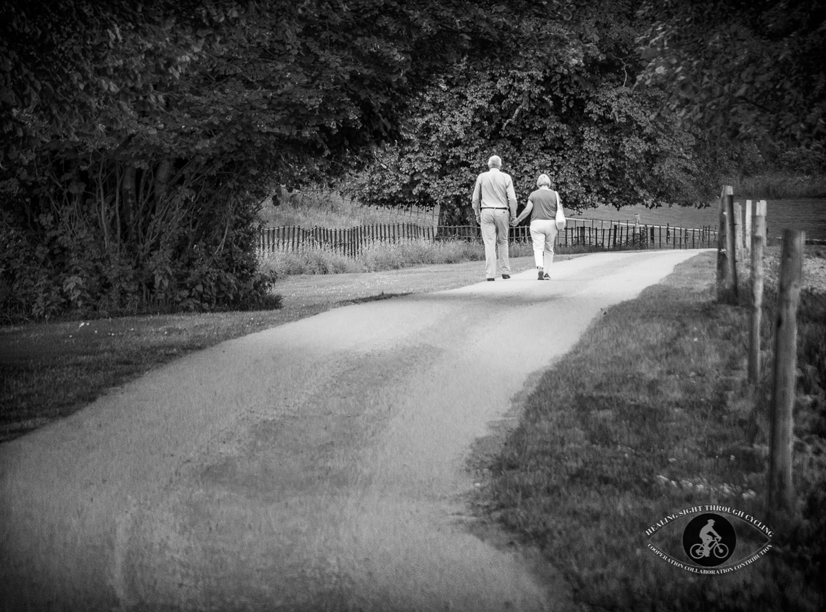 Couple walking on the path at Muckross Gardens - Killarney - County Kerry - BW