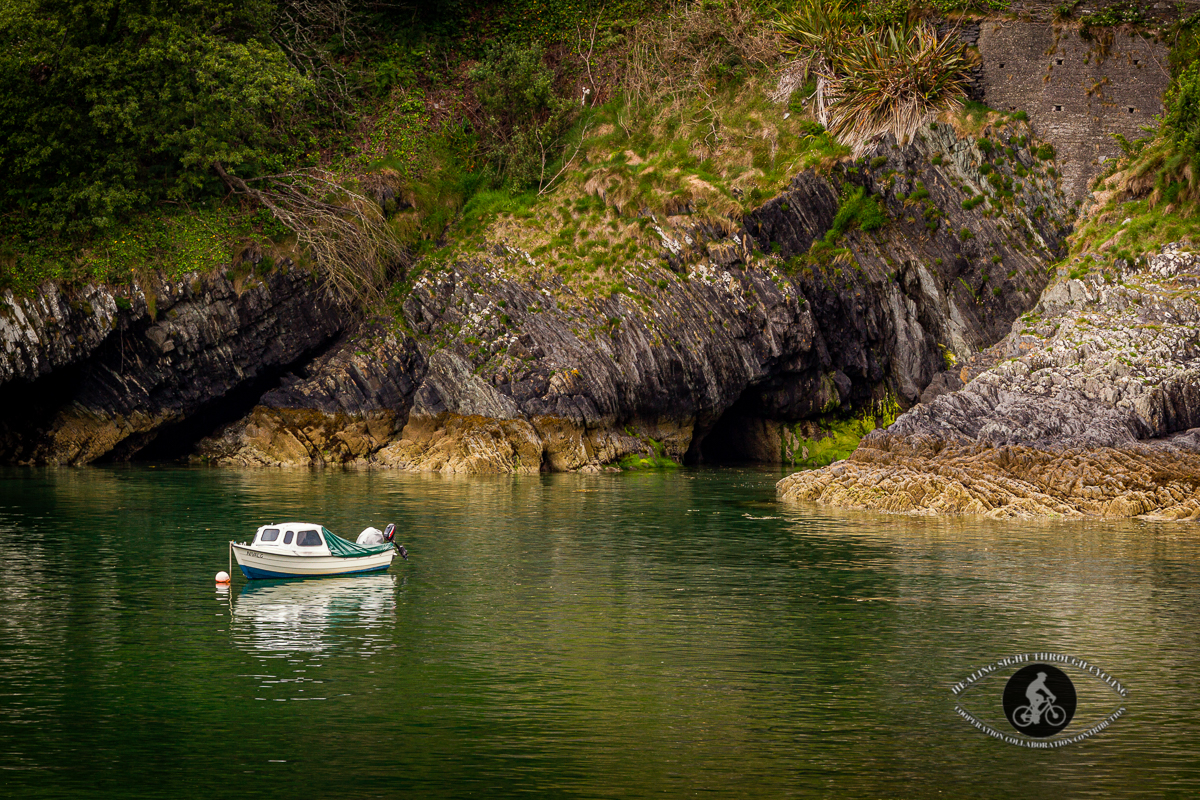 Small fishing boat in rocky cove - Glandore County Cork