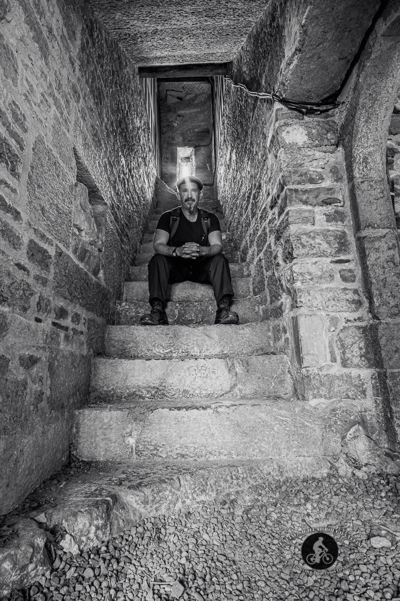 Sitting on stairs to nowhere in the Adare Augustinian Friary - County Limerick - BW