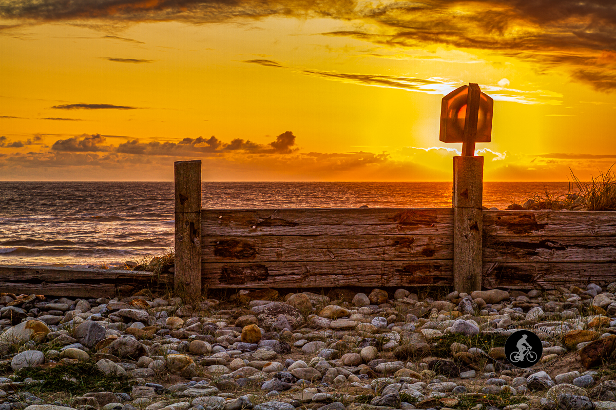 Sun setting through lifeguard ring on beach of Strandhill Caravan & Camping Park - County Sligo