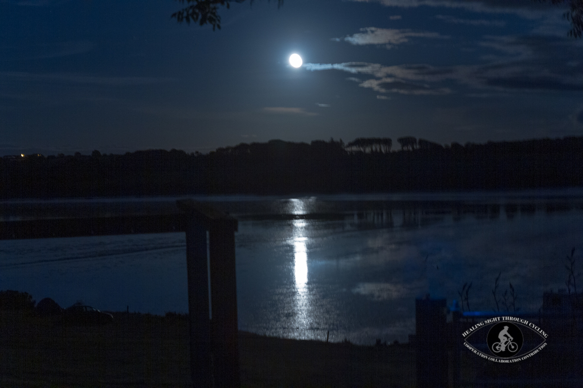 Rising moon over the water